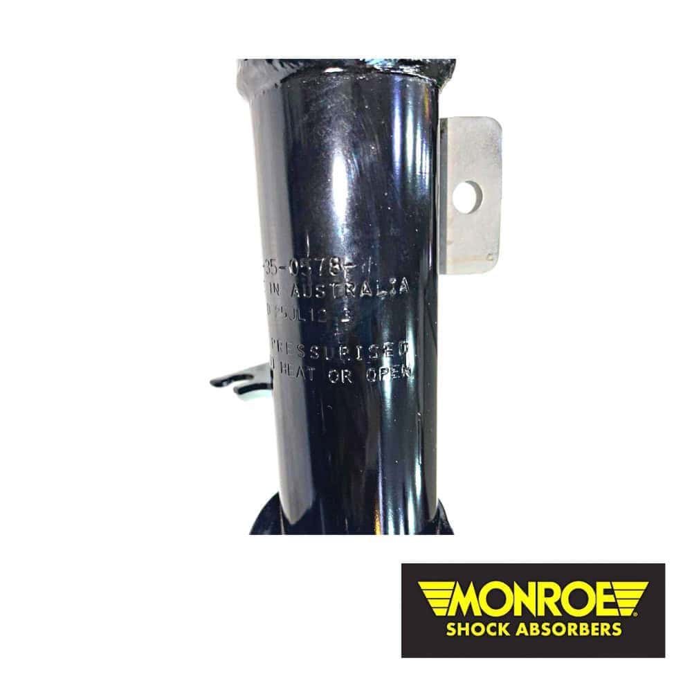 Heavy-duty shock absorber component for industrial use, branded Monroe.
