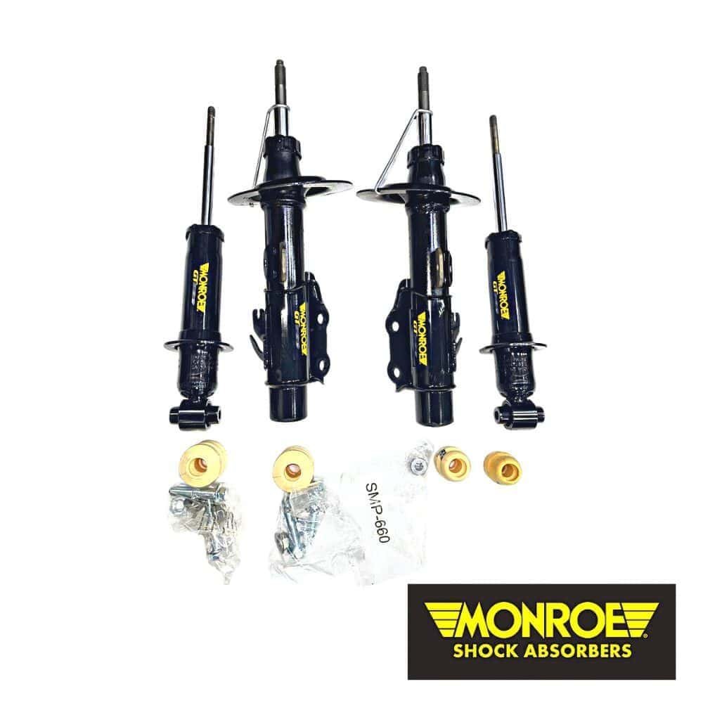 Shock absorber set for vehicle suspension, Monroe brand, with mounting hardware included.