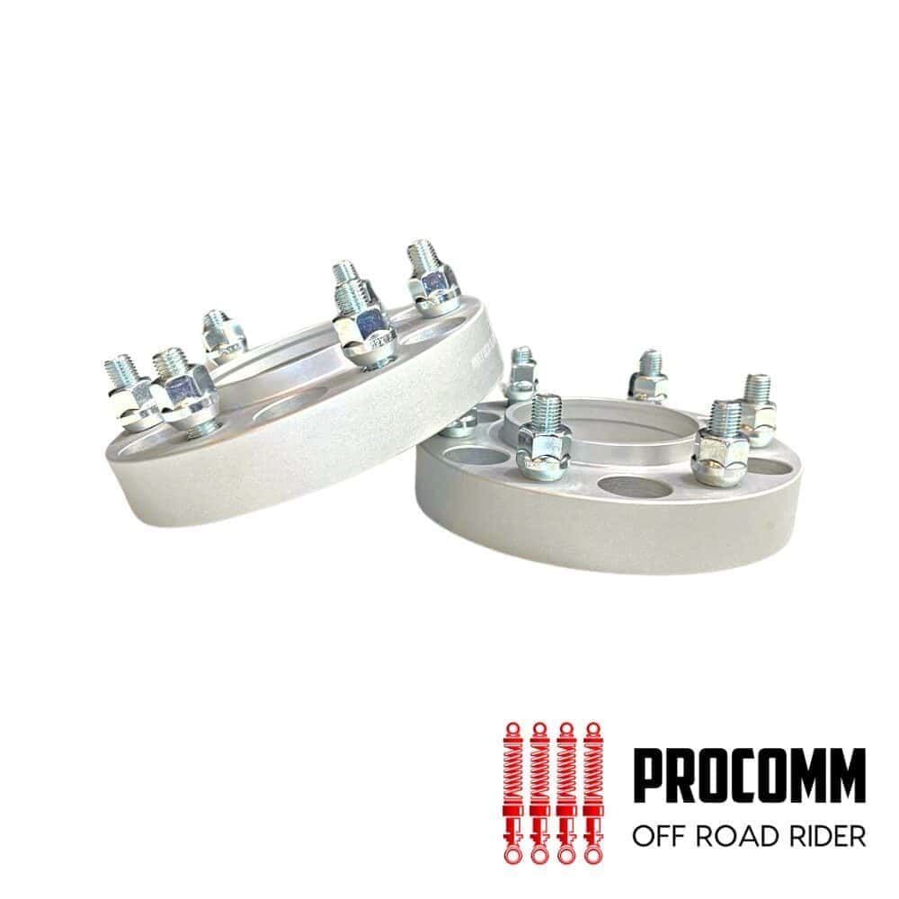 Heavy-duty off-road vehicle wheel spacers with bolts for enhanced stability.