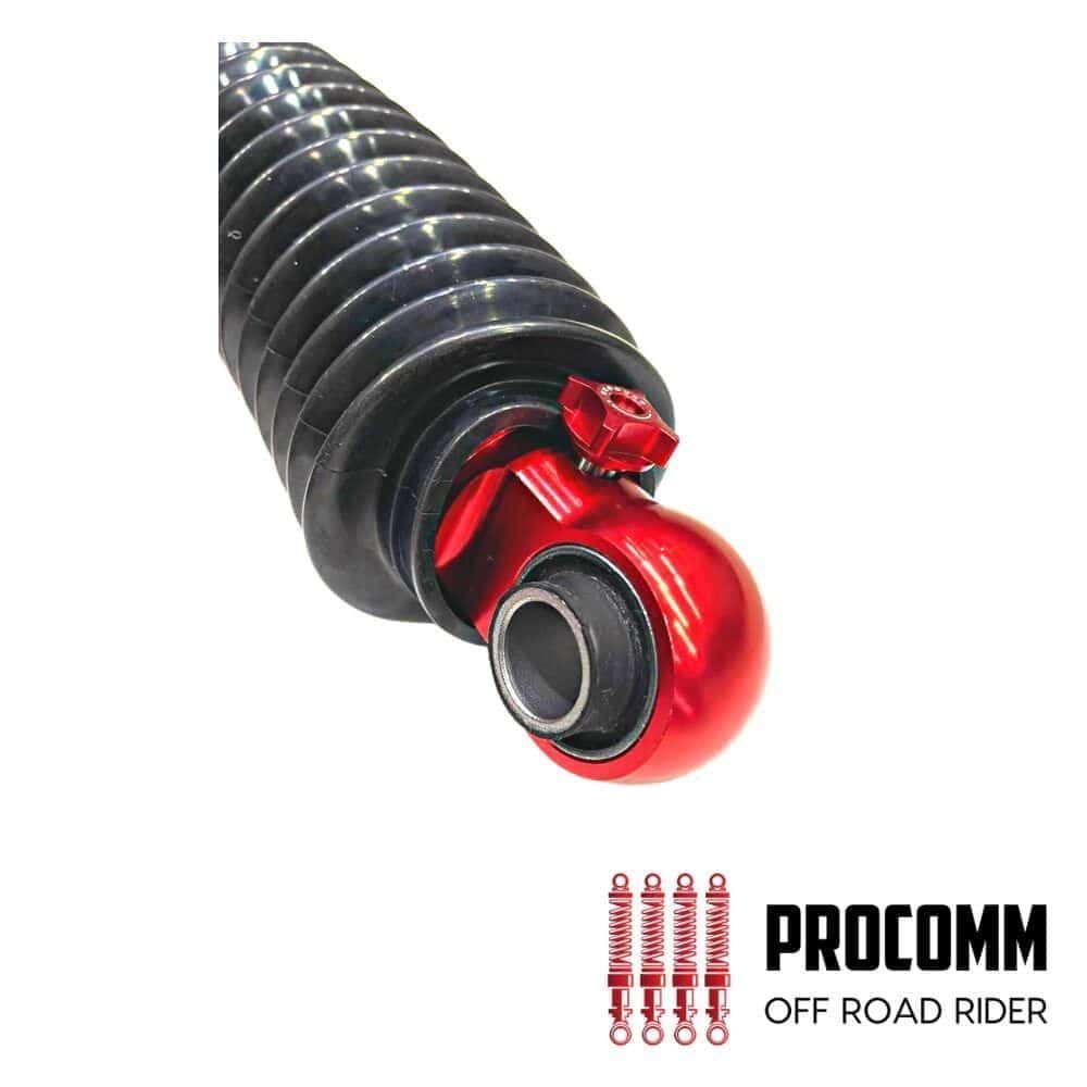 Off-road motorcycle shock absorber with red coil spring and black body.