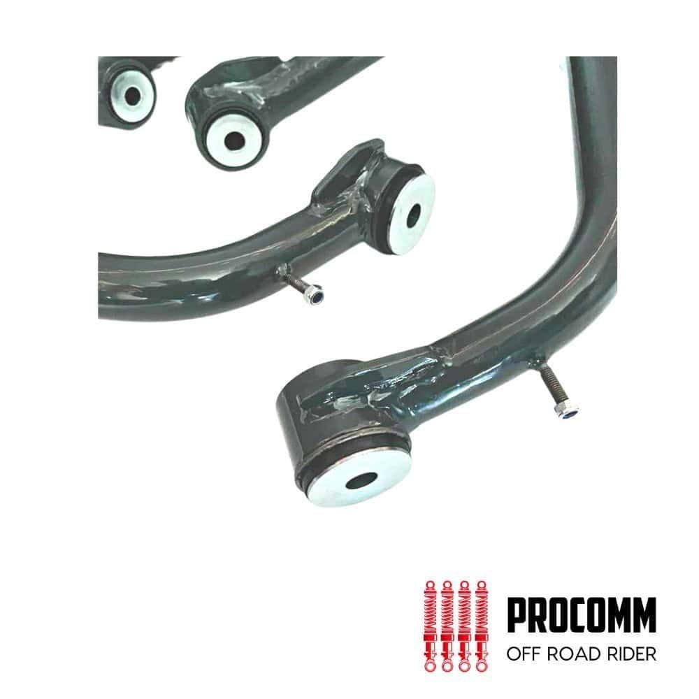 Off-road vehicle suspension parts with PROCOMM branding for durability and performance.