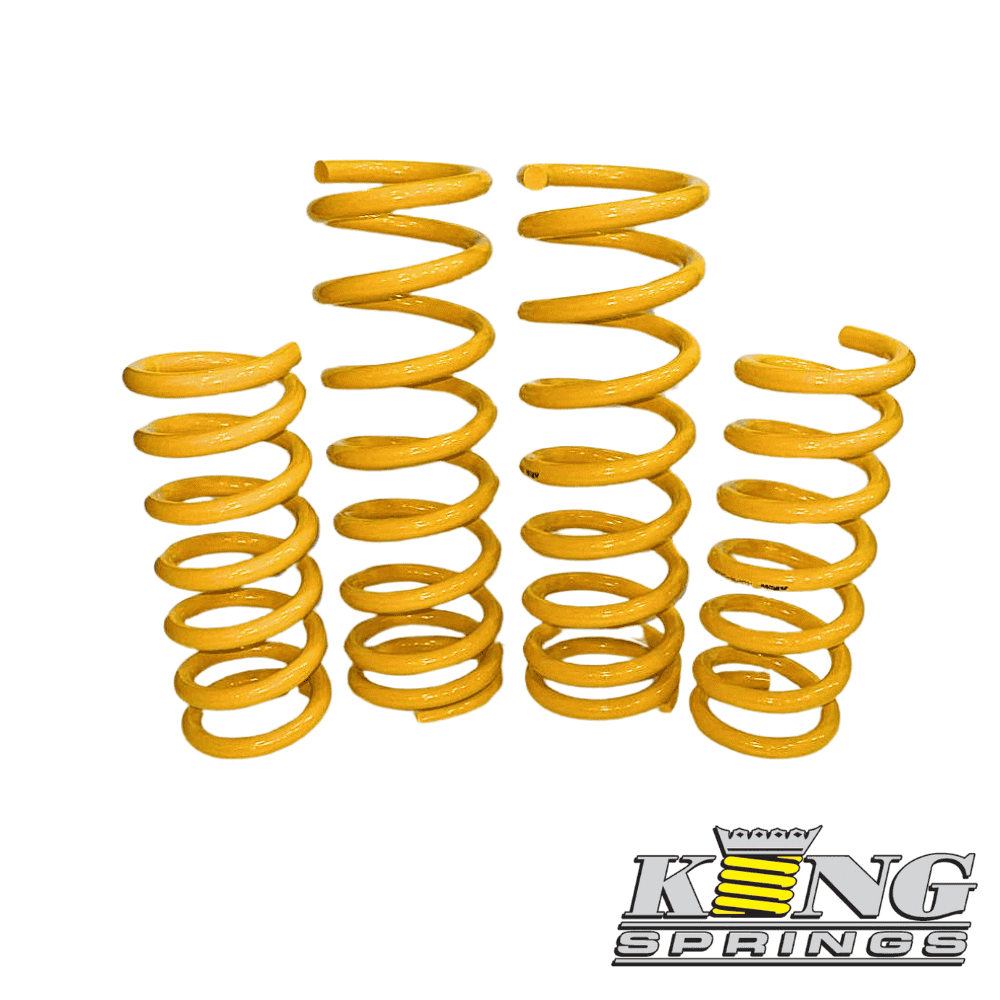 Yellow coil springs for automotive suspension, displayed in a row.