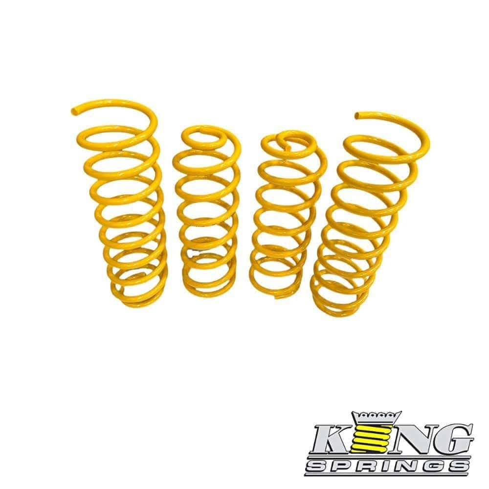 Yellow coil springs for automotive suspension, used for shock absorption and ride comfort.