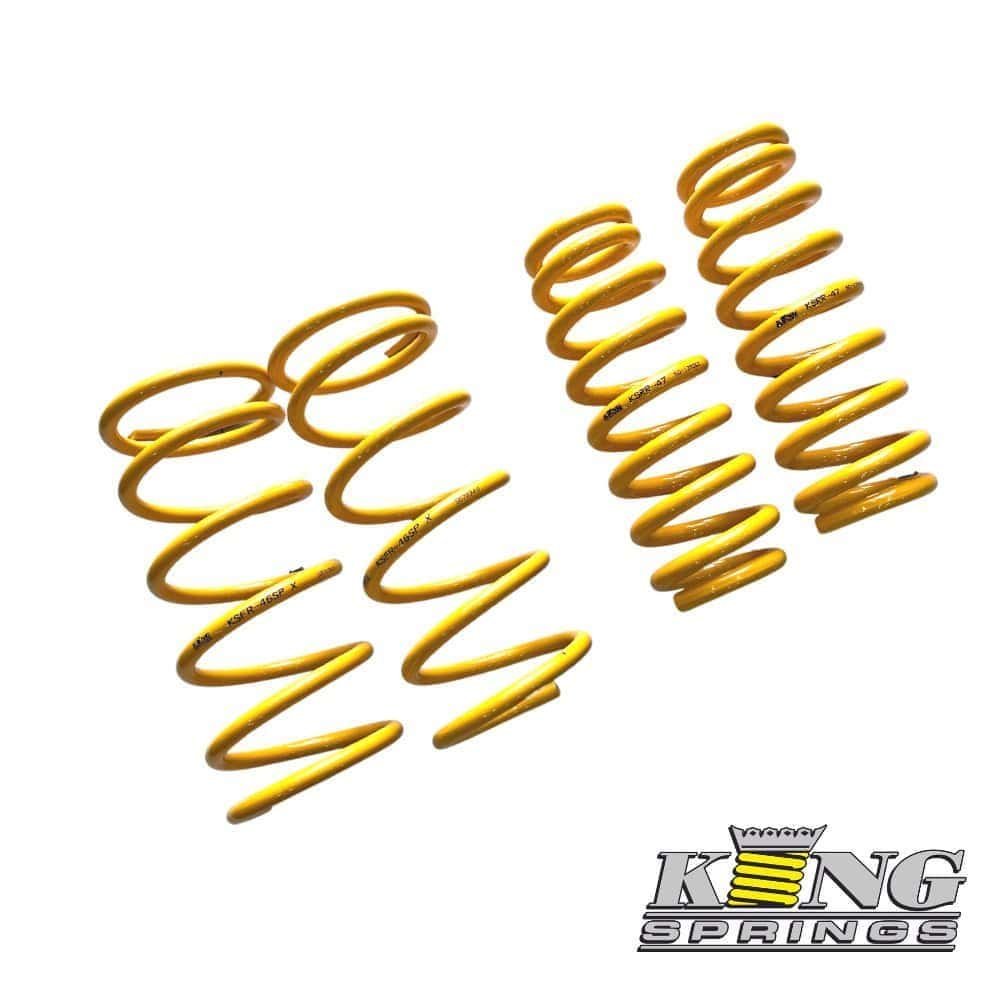 Yellow coil springs for automotive suspension, high-quality King Springs.