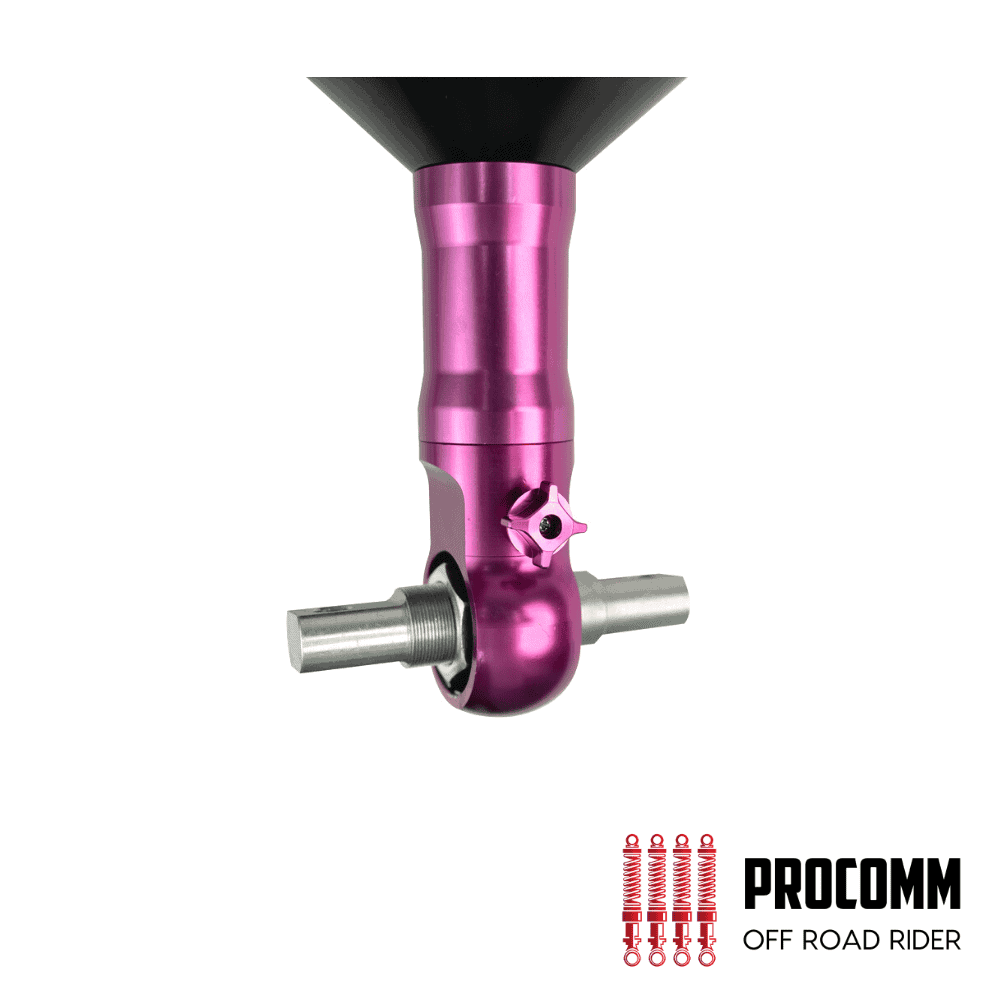 Off-road rider suspension component in pink for enhanced vehicle performance.