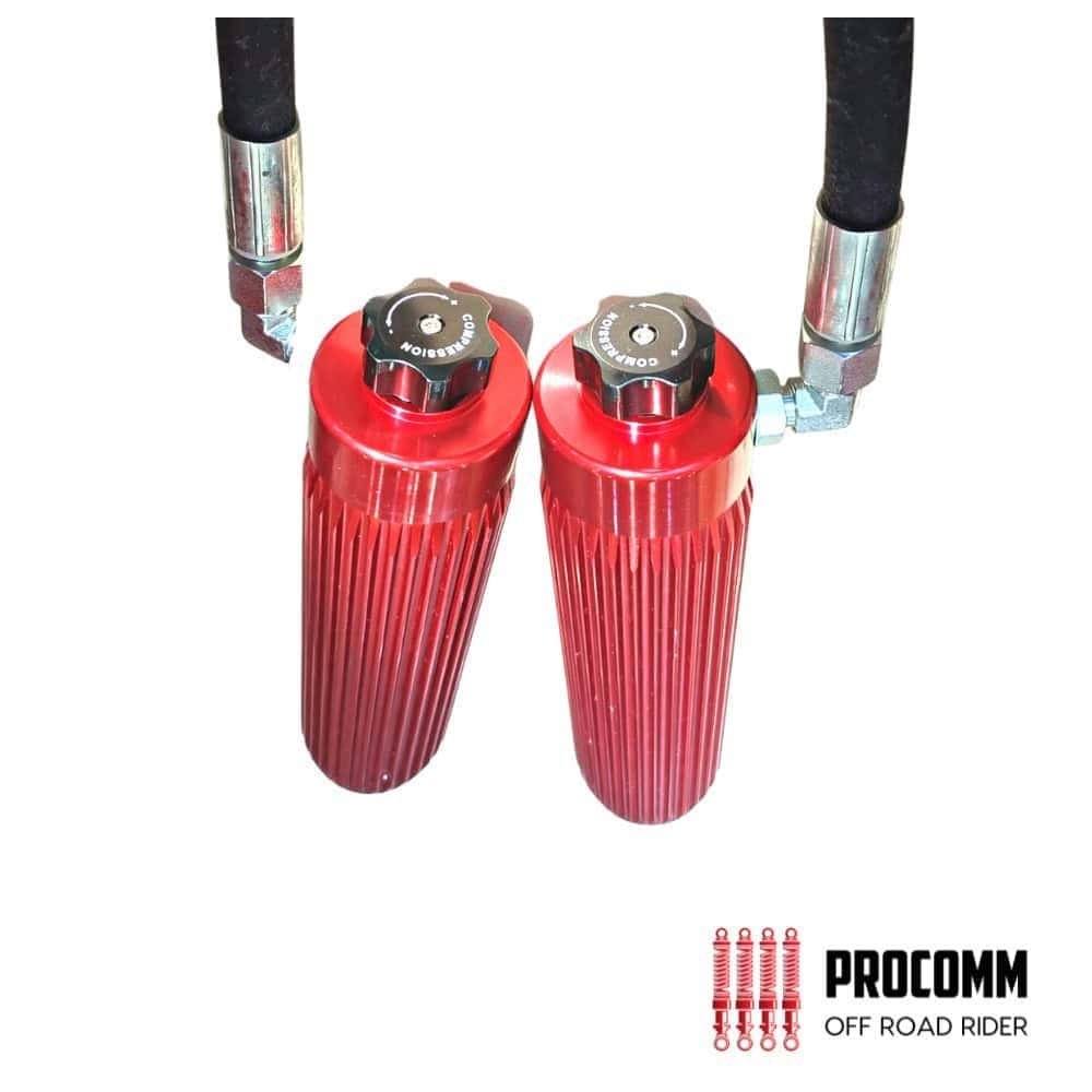 High-performance off-road rider shock absorbers with red anodized finish for durability and style.