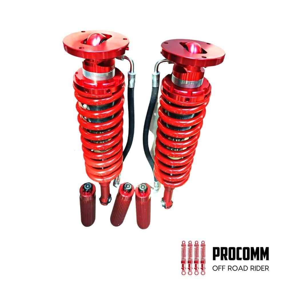 Red off-road shock absorbers for vehicles, high-performance suspension components.