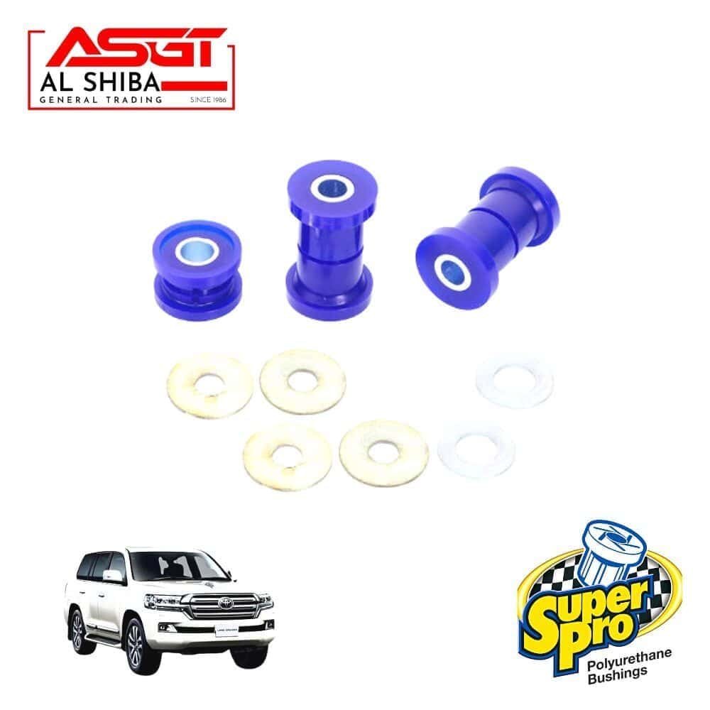 Blue polyurethane bushings with white washers for automotive suspension.