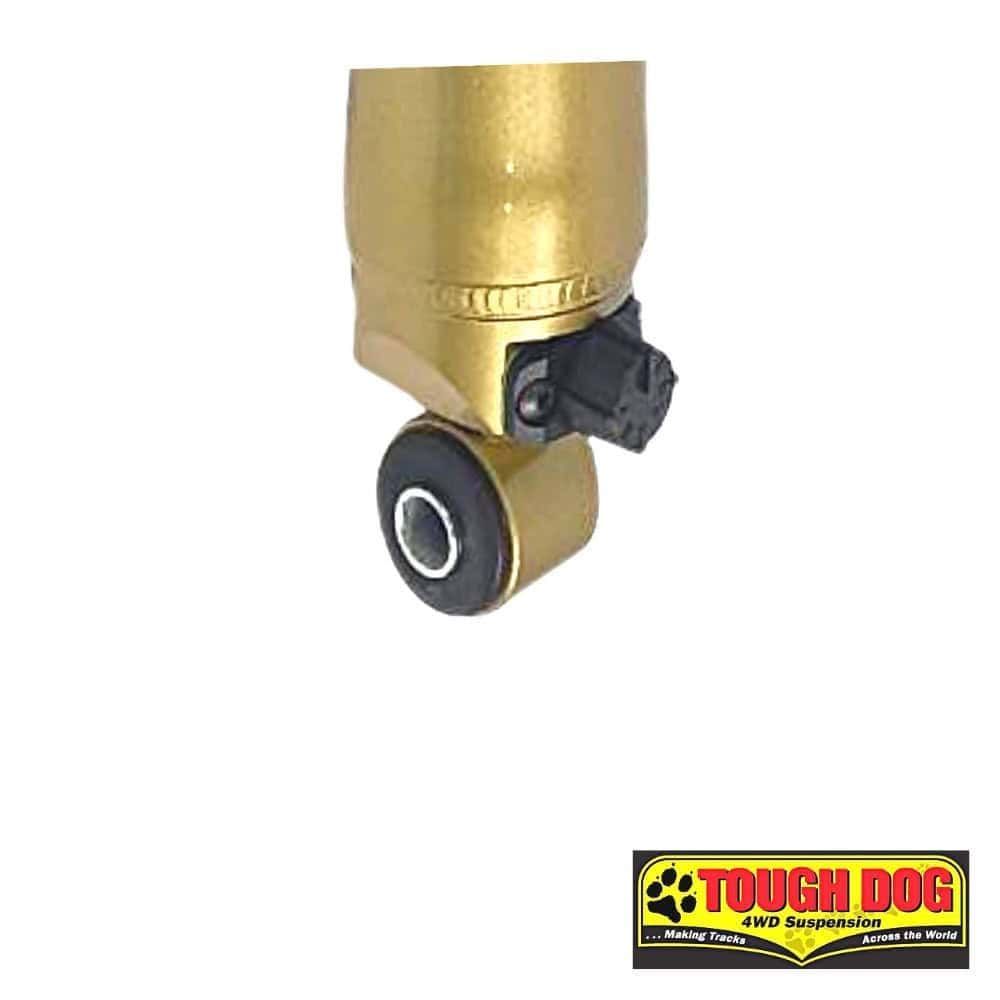 Shock absorber component for heavy-duty vehicles, gold-colored with mounting hardware.
