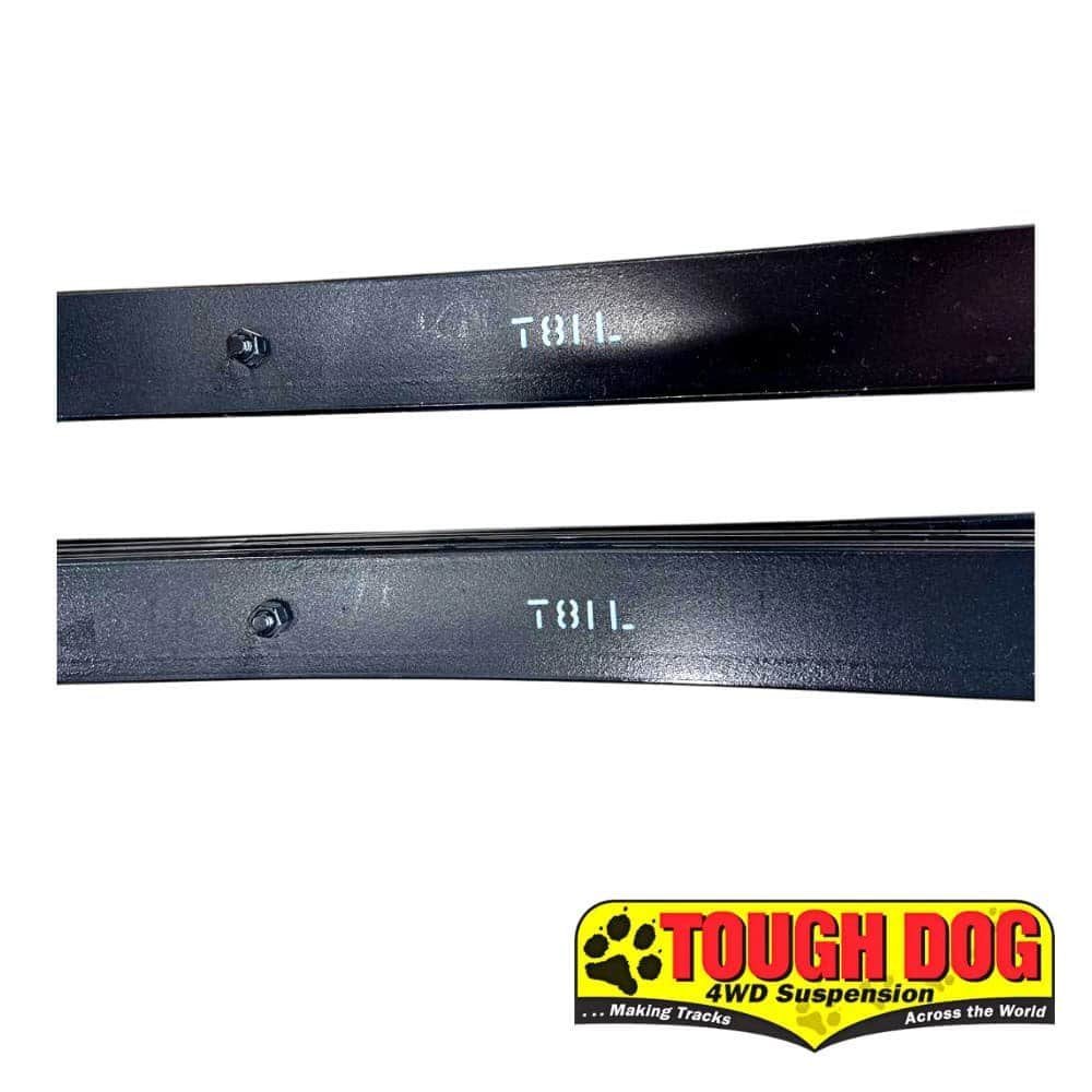 Heavy-duty black rubber door stoppers with "TOLL" branding for industrial use.