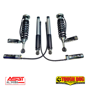 Four metal shock absorbers with black coil springs, part of an off-road suspension kit, featuring Tough Dog and AL Shiba branding.