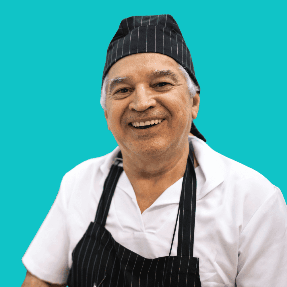 Soumission assurance Boucherie Homme souriant en tenue de chef cuisinier