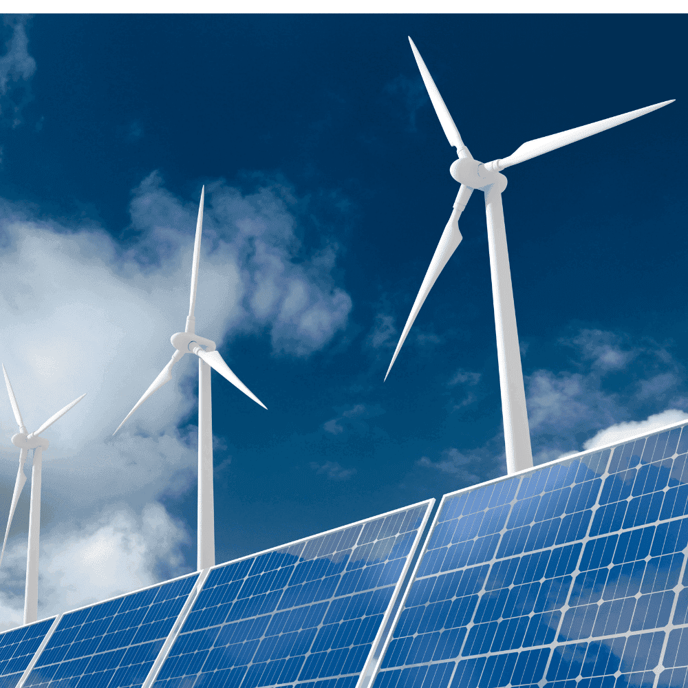 Éoliennes et panneaux solaires sous ciel bleu