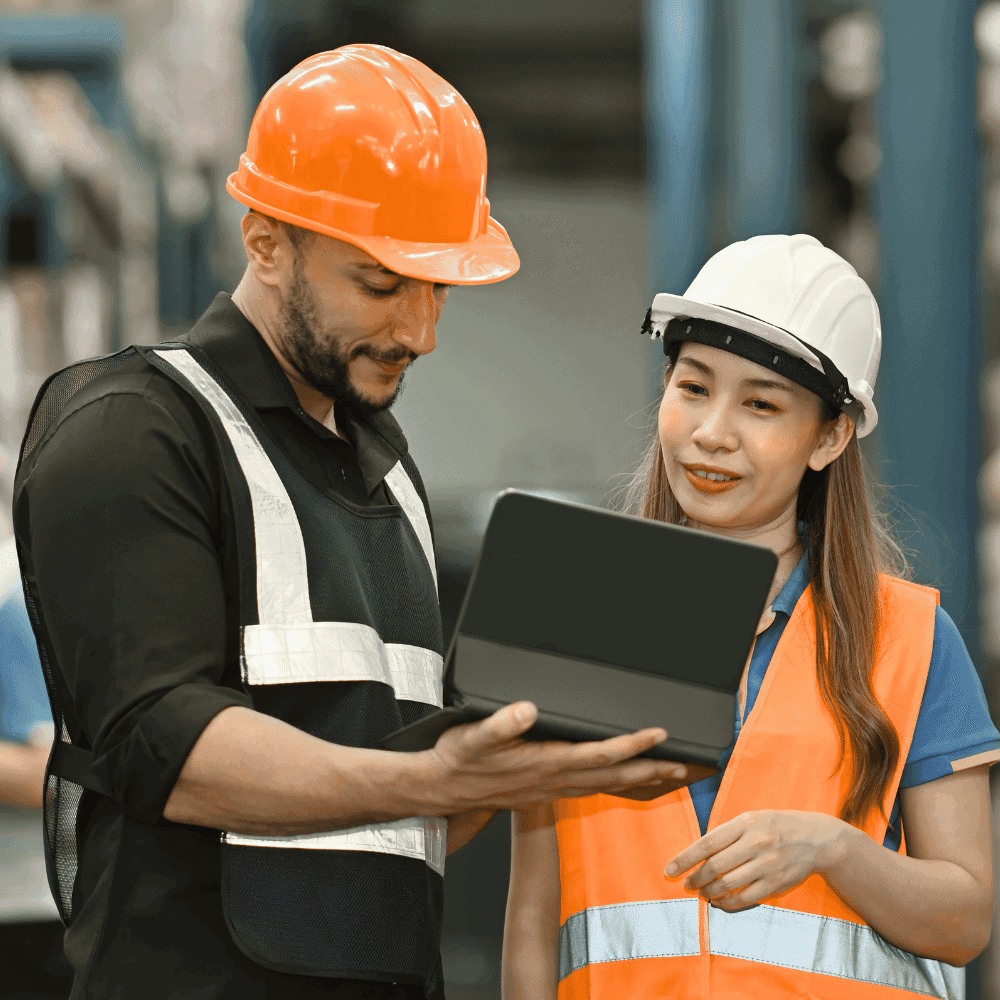 Workers evaluating data on laptops.