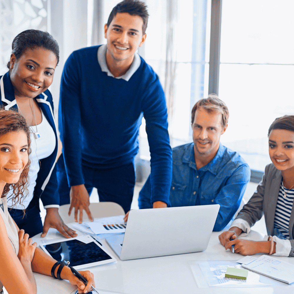 IT Business Insurance Quote Diverse team in office meetings.