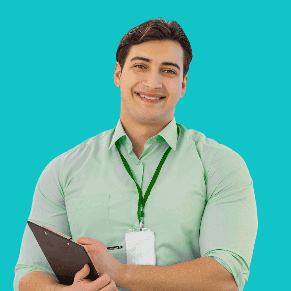 Smiling man with green shirt and badge