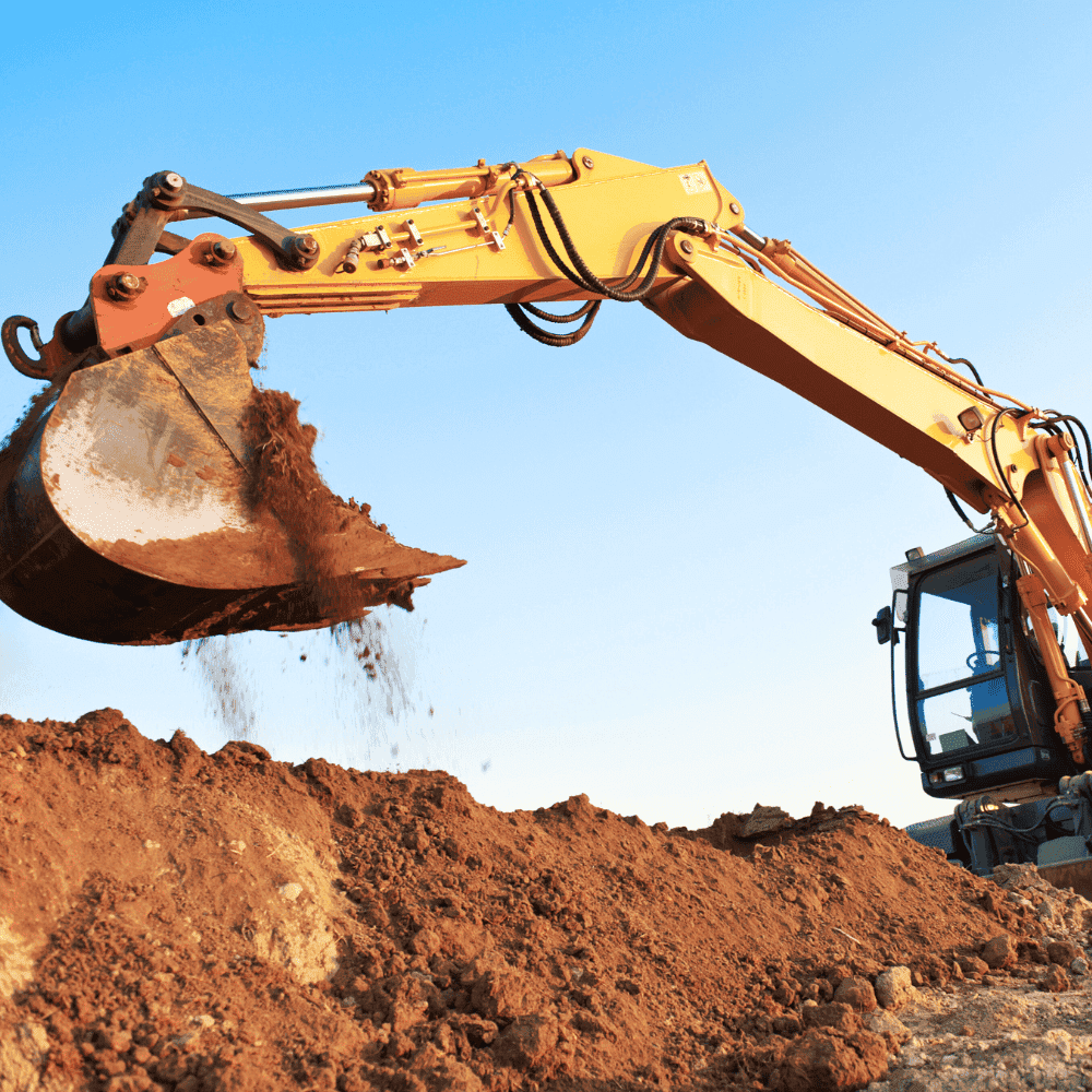Excavation Business Insurance Quote Mechanical excavator moving earth on site.