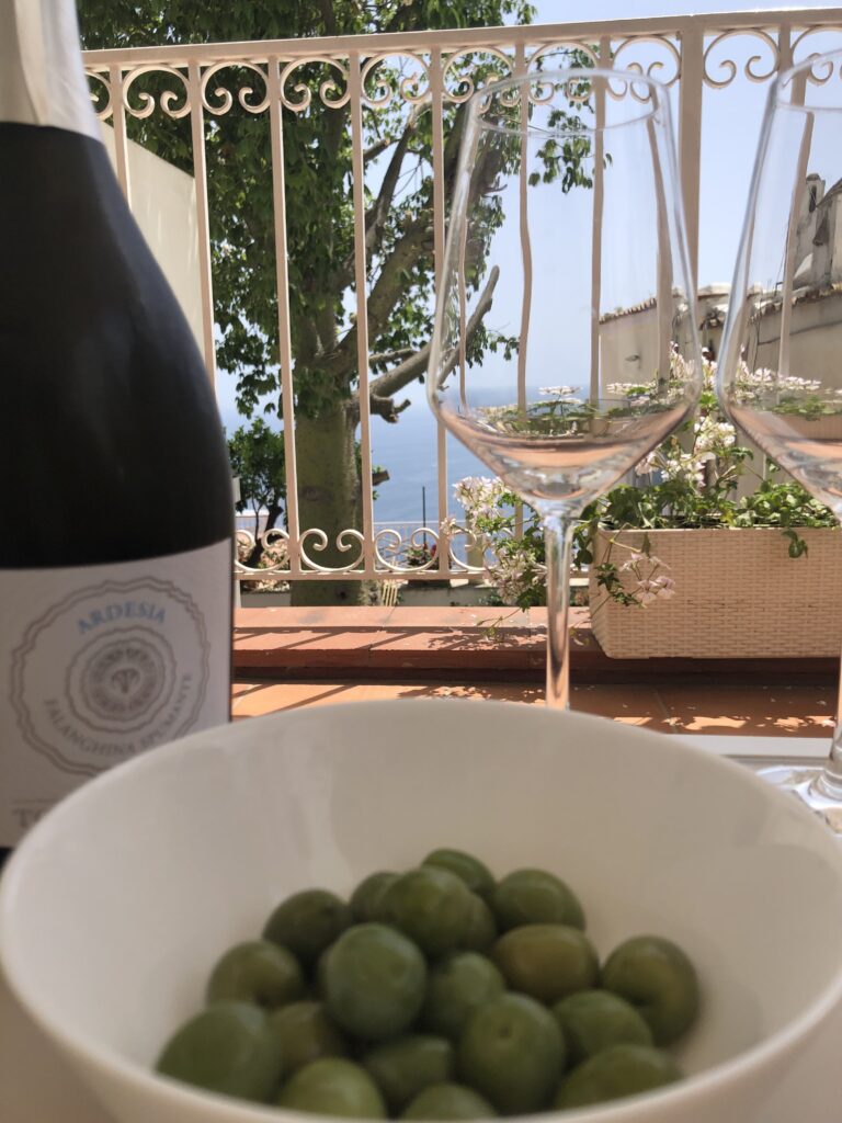 Olives and prosecco on the balcony at Casa Malu in Positano.