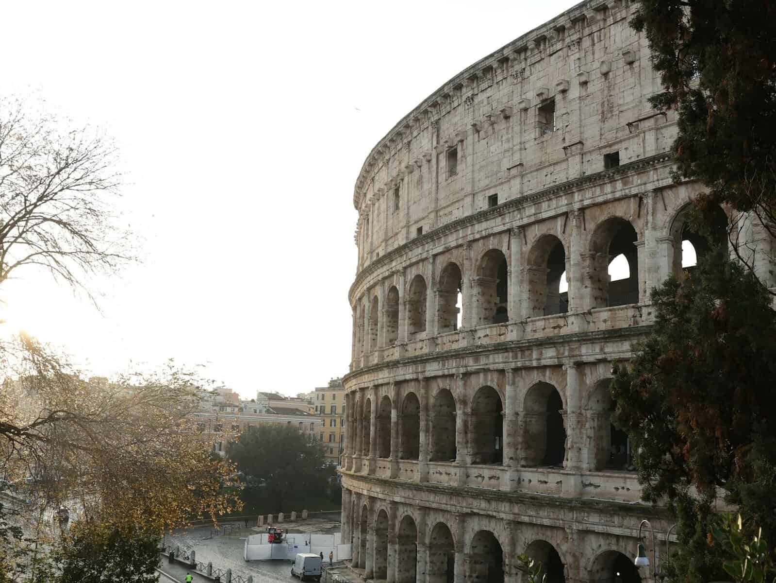 Capture of the iconic Colosseum in Rome, showcasing its grandeur in the early morning light.