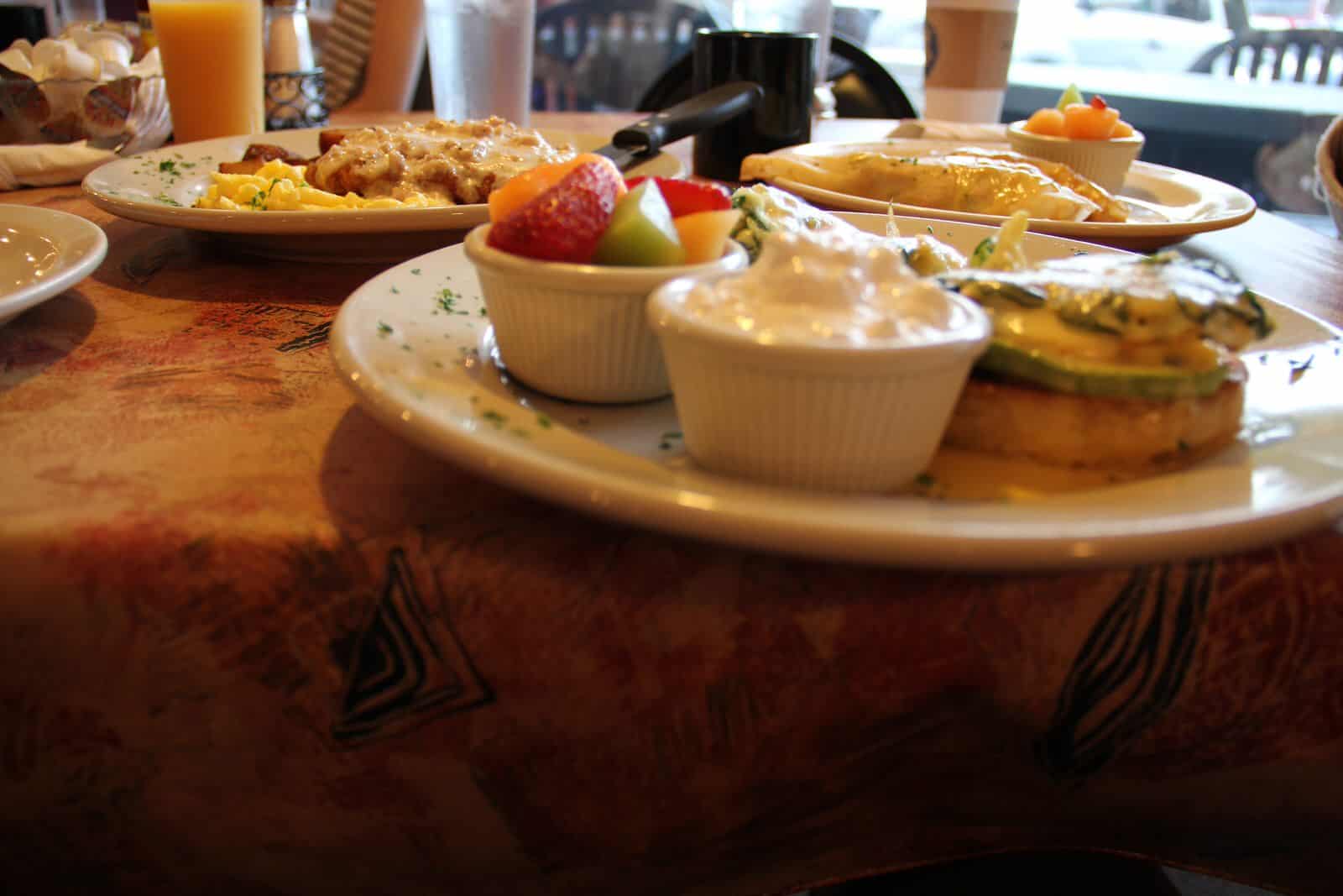 Dining table with breakfast plates inside Bailey’s Breakfast & Lunch in Omaha