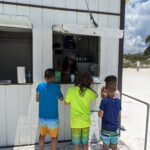 Saving For Backpacking Travel in Southeast Asia: Working Beach Service Making Snow Cones