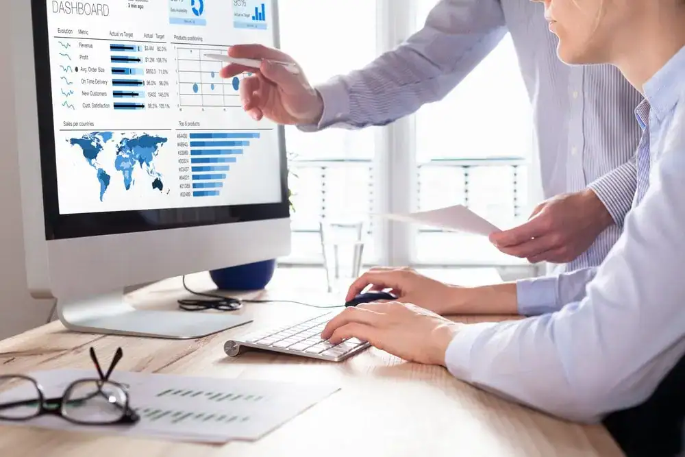 Business analytics dashboard showing global data and charts for decision making.
