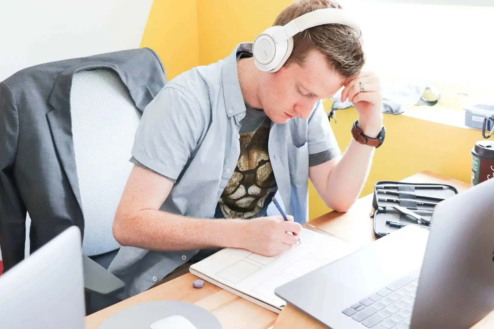 Person with headphones listening to social audio content