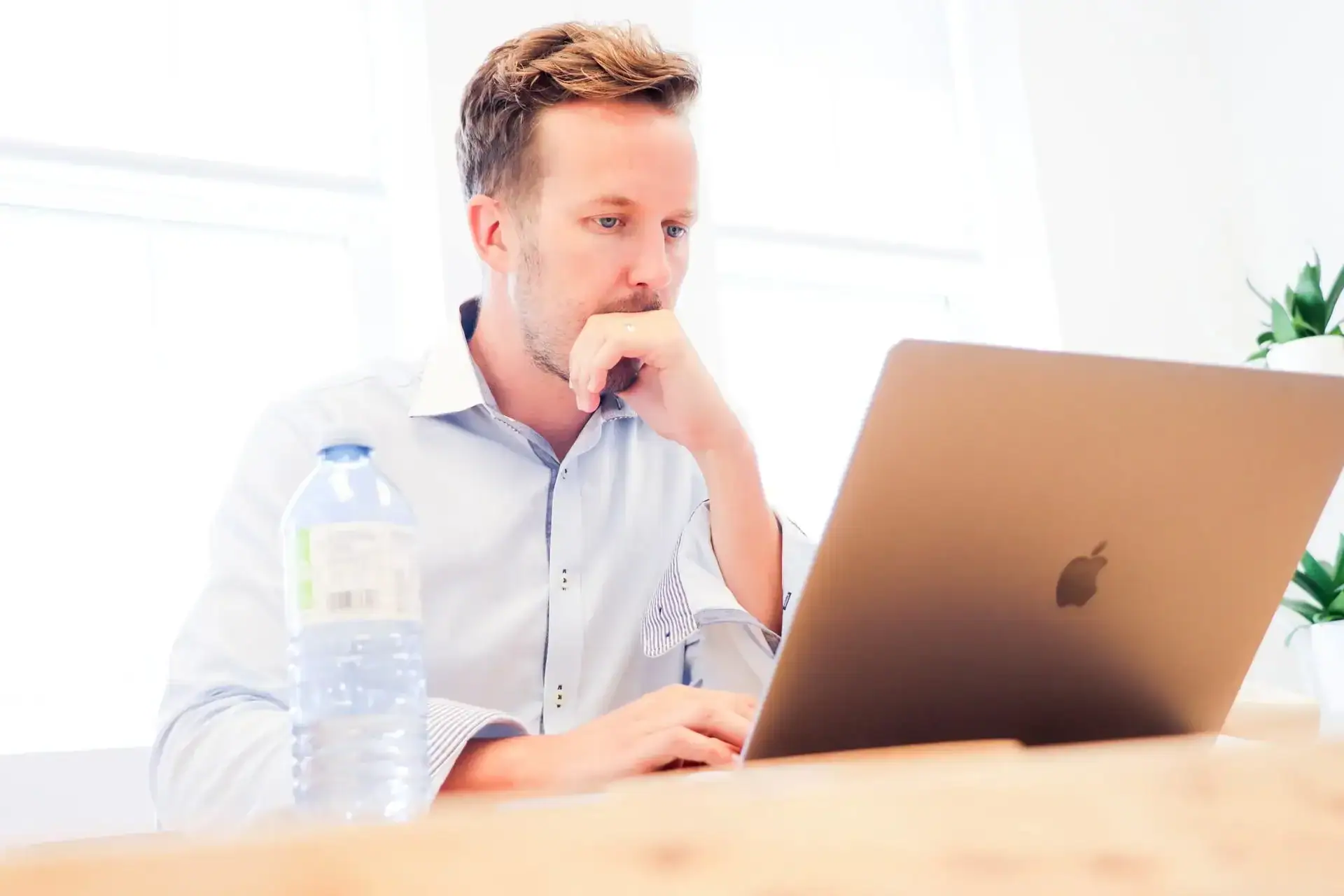 man on laptop creating an email marketing automation.