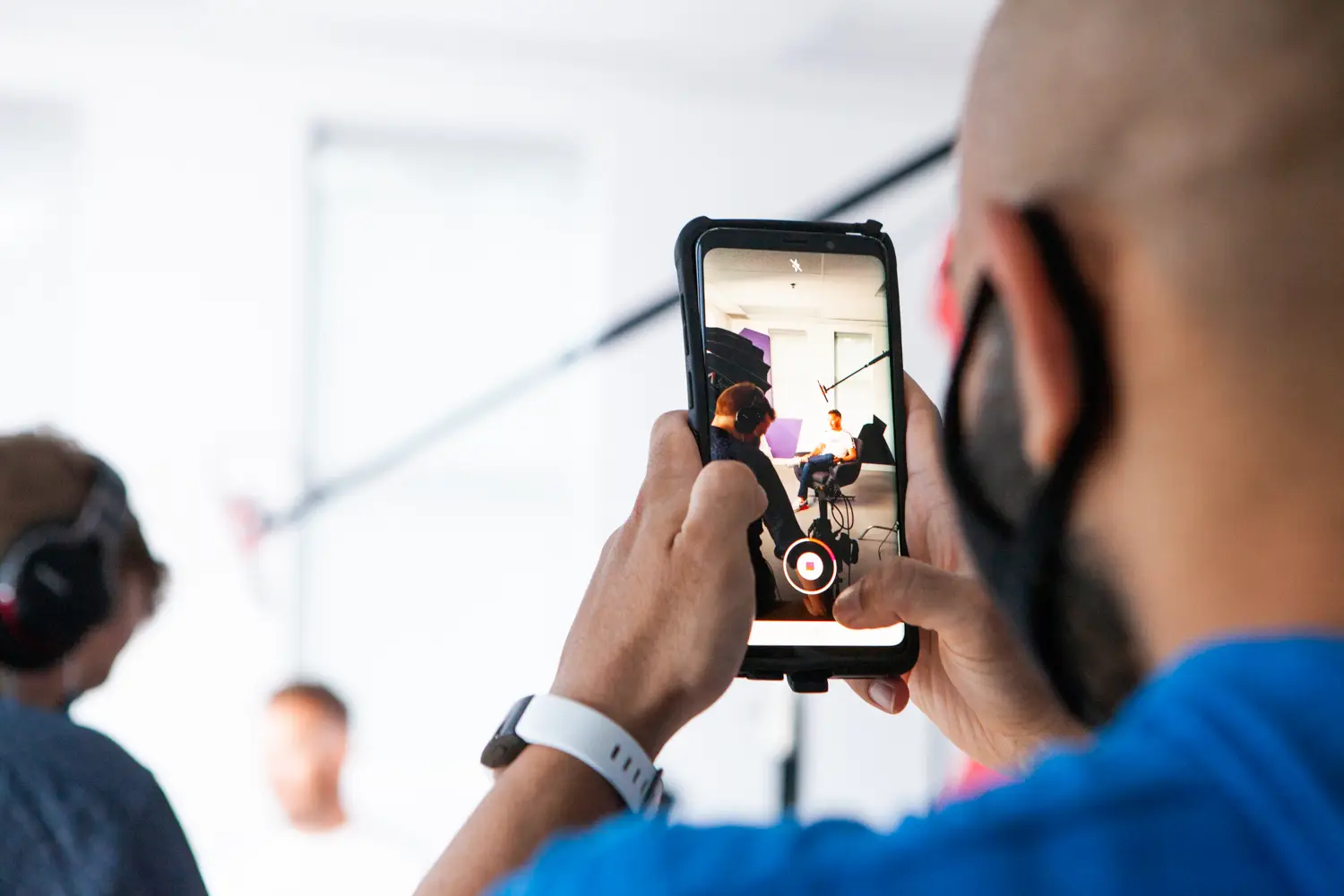 Mahfuz, our Senior Brand Manager, taking a short video on his phone.