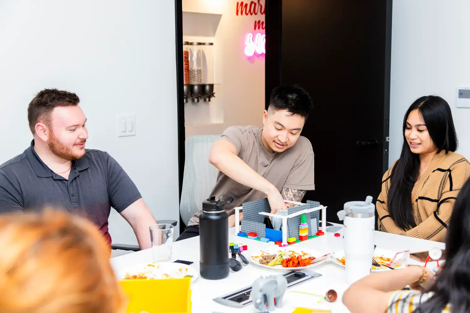 Diverse group of young professionals collaborating on a creative project.