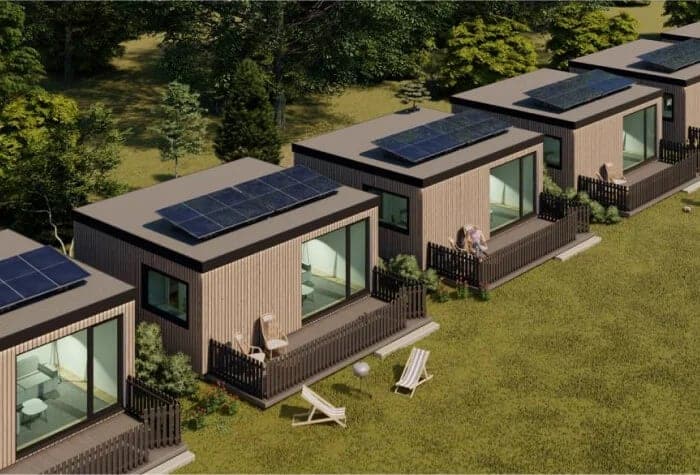 Casas sostenibles con paneles solares en fila.