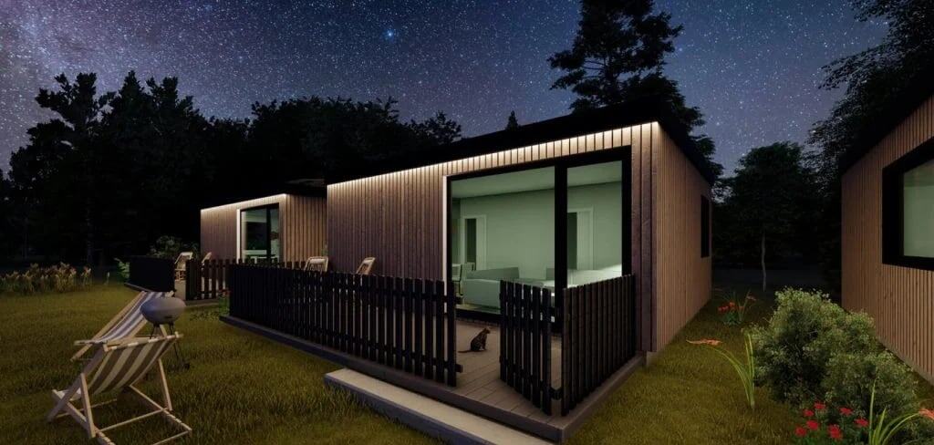 Casa moderna de noche con cielo estrellado.