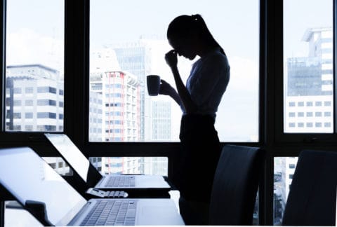 CBT Canary Wharf Worried Woman with head in her hands thinking