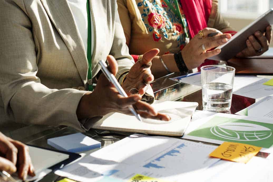 Photo of people talking during a meeting.
