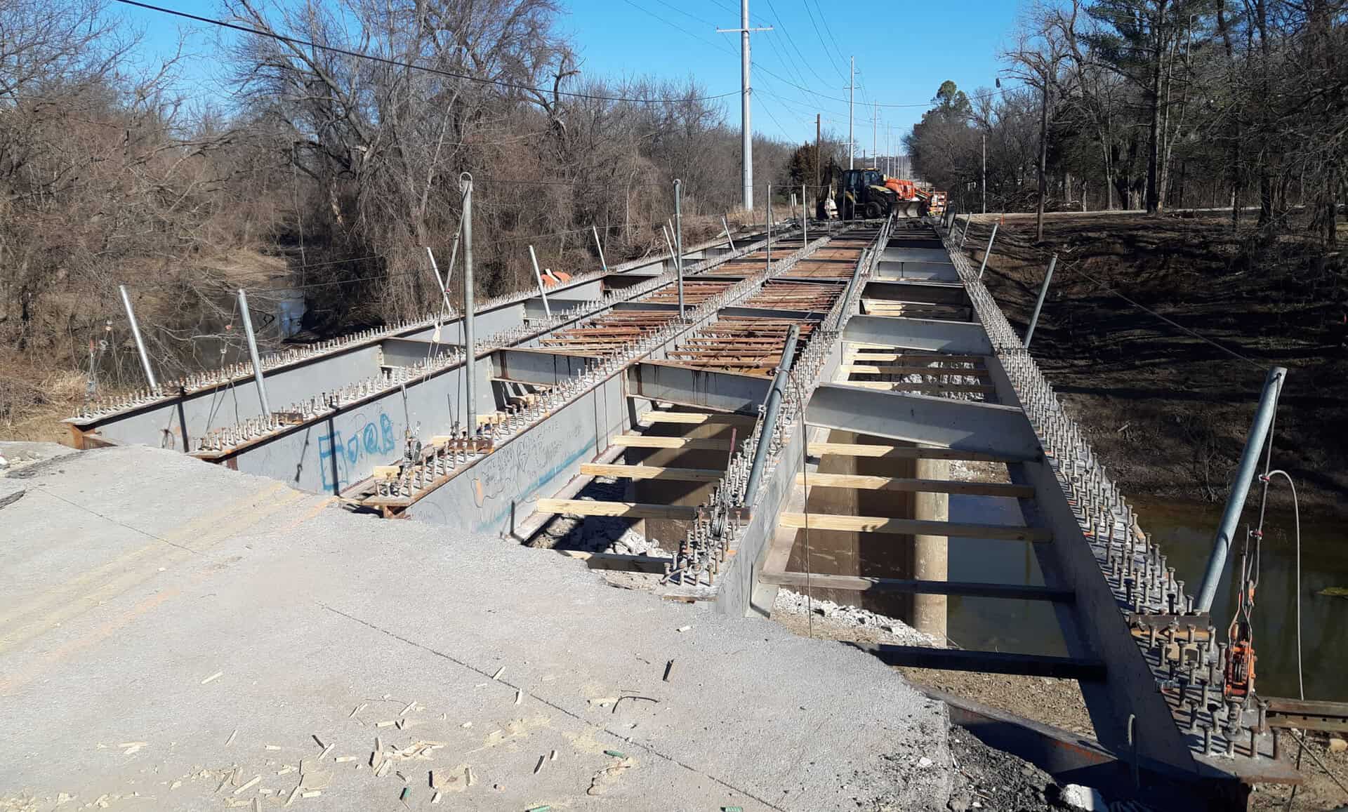 Image shows construction work on the Sunset Boulevard Bridge over Butler Creek.