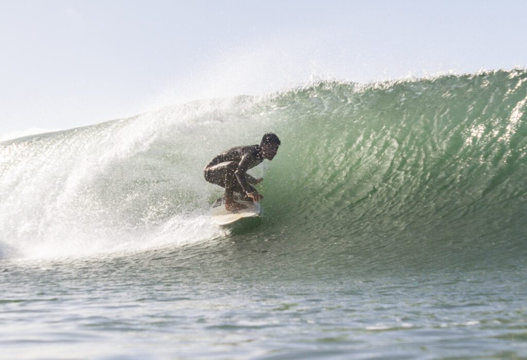 Surfer riding a barrel at the best Surf Camp in Nicaragua