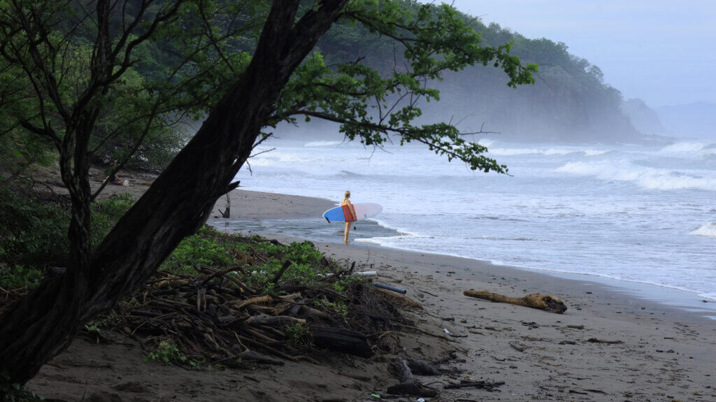 Surfer on the beach in Nicaragua