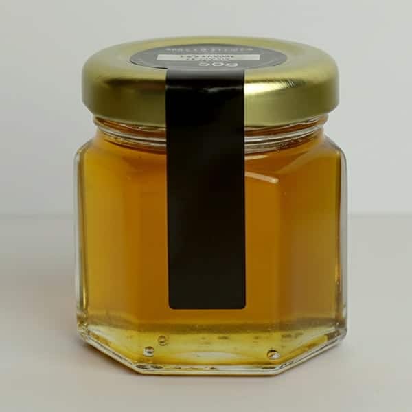 Tarro de miel natural con tapa dorada