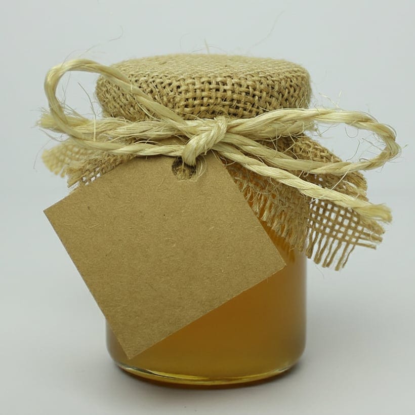 Tarro de miel artesanal con etiqueta kraft