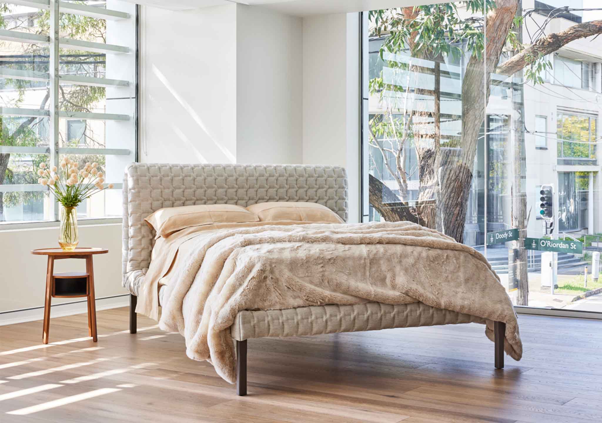 Ligne Roset Ruche Bed: Arti Ecru Upholstery with Champagne Faux Fur Throw