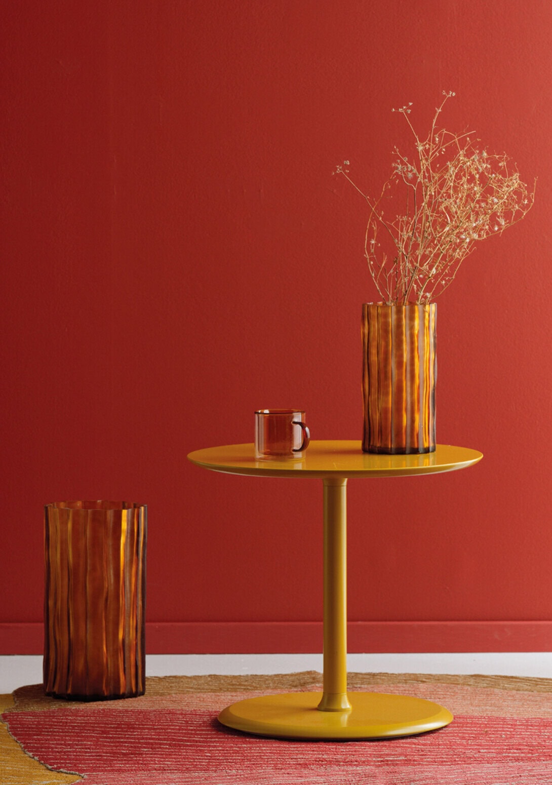 Ligne Roset Ribbed Vase Amber Large and Small, sold separately.