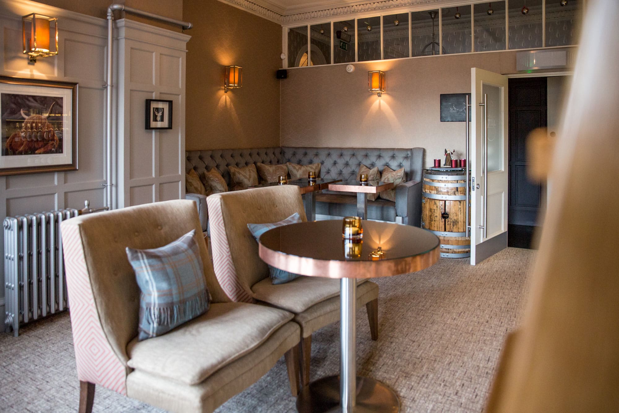 Cozy interior of The Dowans Hotel Speyside Moray with plush seating and warm lighting.