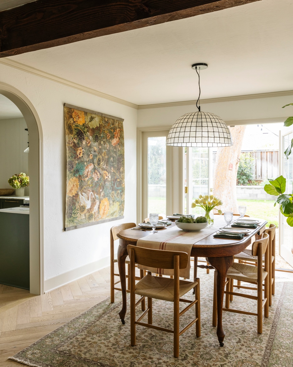cheery dining room with herringbone hard wood floors