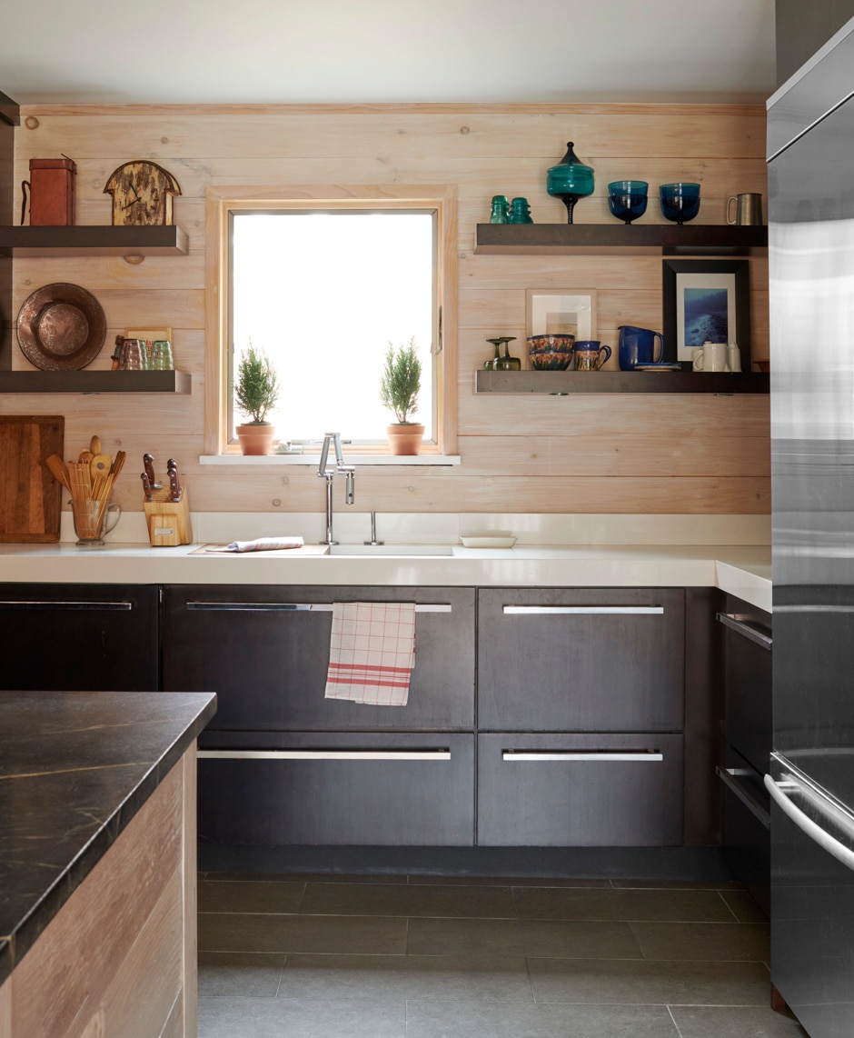 kitchen with wooden plank walls and gray cabinets
