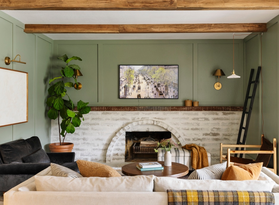 green living room with brick fireplace