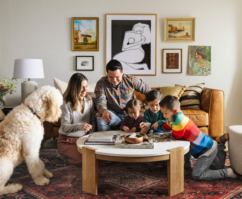 family portrait in living room doing a puzzle