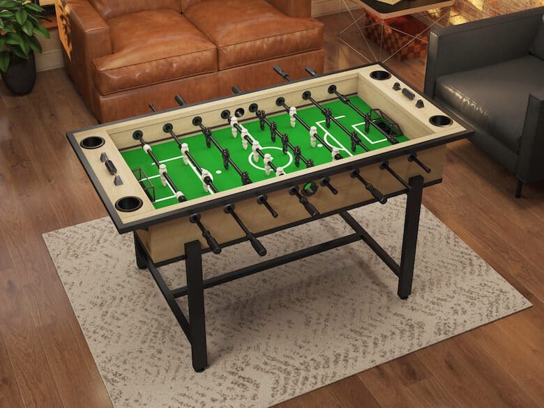 Foosball table in a cozy living room with leather and fabric seating