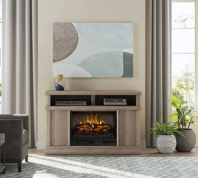 Freestanding Media Console Wooden Electric Fireplace with a realistic flame effect, sitting beneath a framed painting in a living room