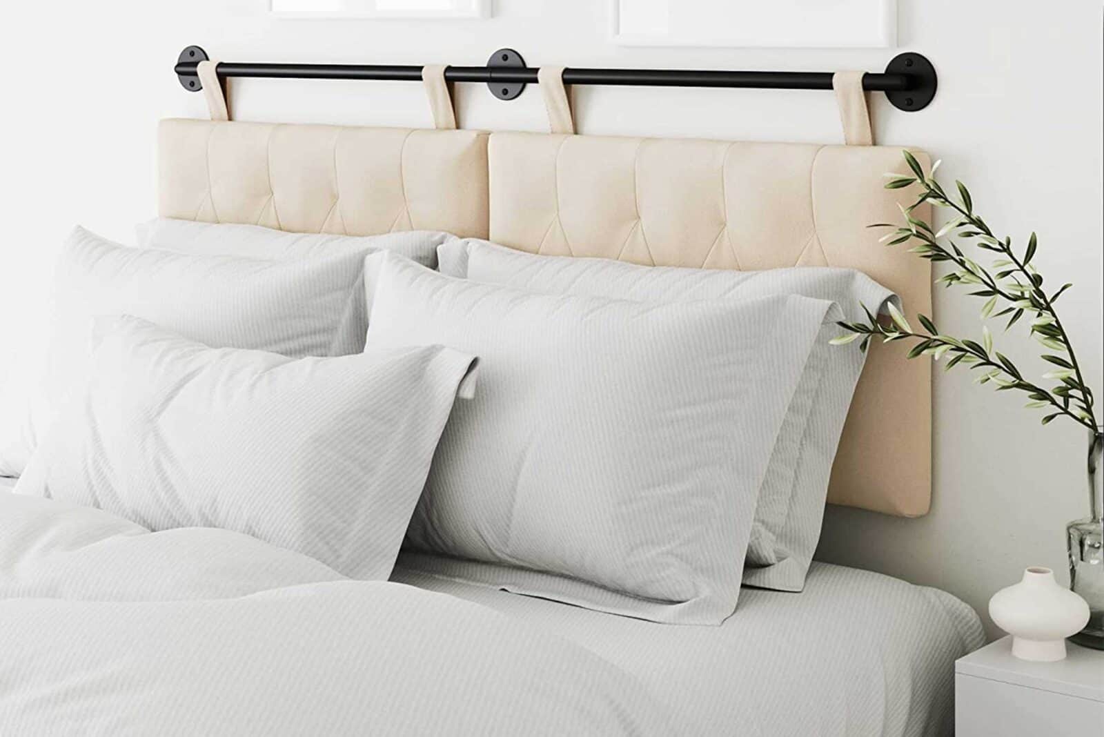 Cozy bedroom with tufted headboard, crisp white bedding, and minimalist decor