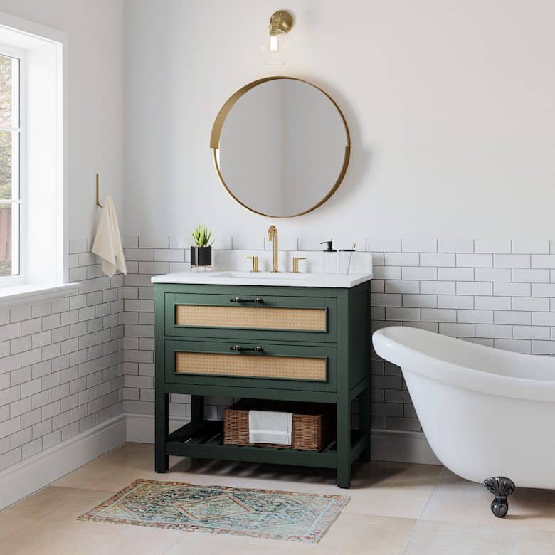 Stylish bathroom with green vanity, round mirror, and clawfoot tub